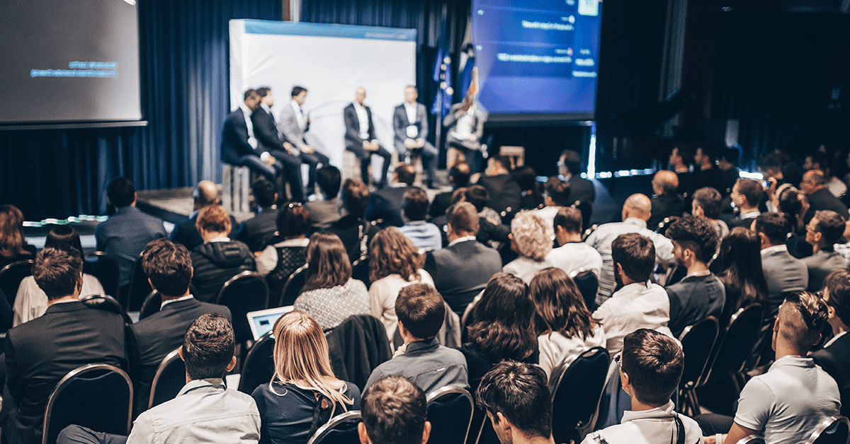 Top Government Events in 2024 - top government contractors A group of professionals inside a conference at a government event