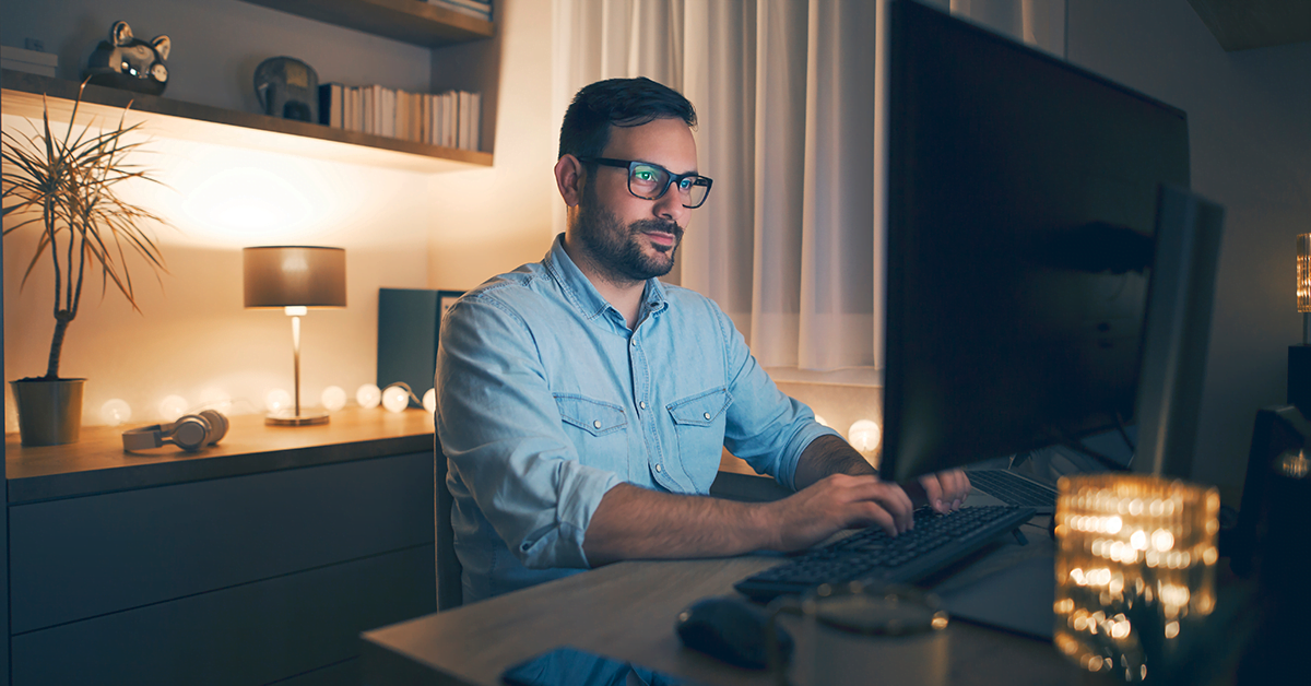 A man working from home during the rise of remote work in the federal government