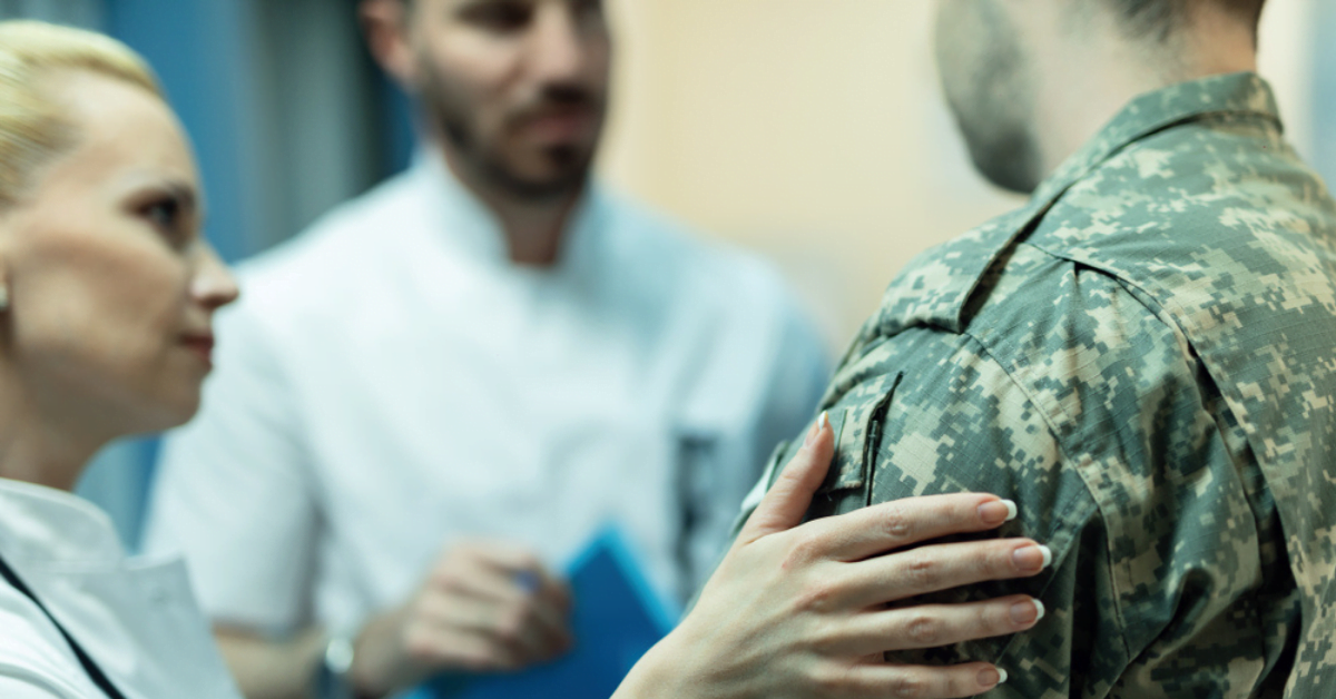VA Funding Cut: What Are Its Implications for Veterans? - top government contractors An Army soldier at a hospital