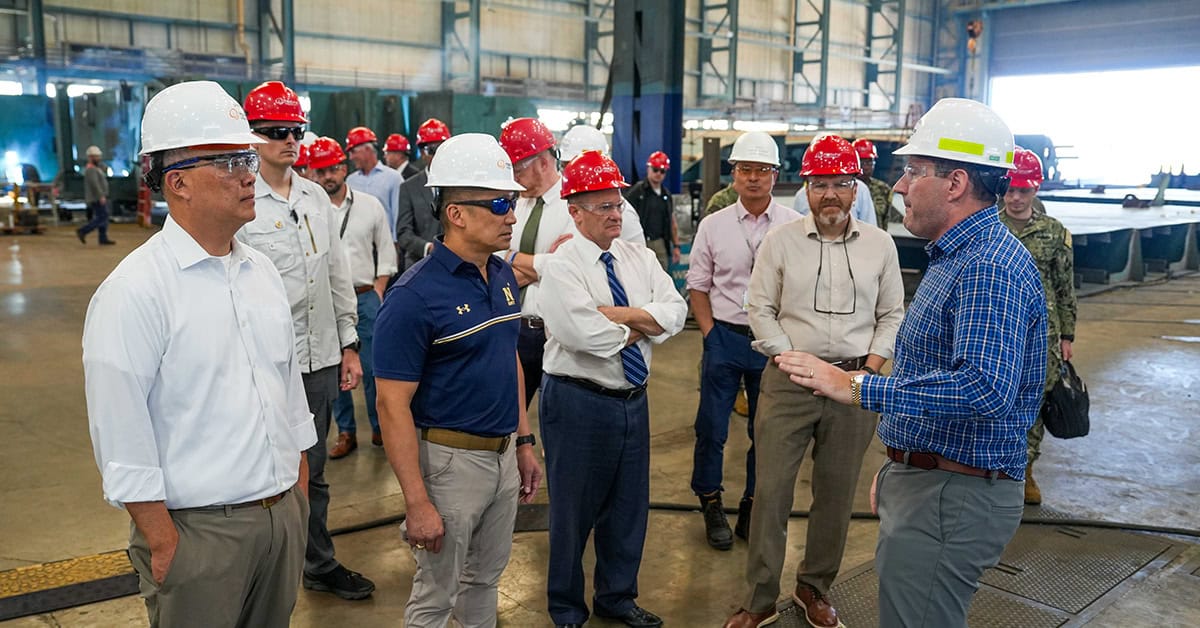 Navy and Hanwha executives. Acting Navy Secretary Hung Cao joined Hanwha Defense USA CEO Michael Coulter and other leaders on a tour of the Hanwha Philly Shipyard.